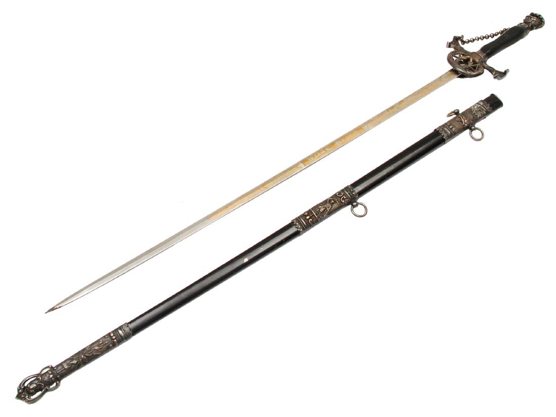 KNIGHTLY MASONIC CEREMONIAL SWORD, CA. 1900: Knight's helmet pommel and balck wooden handle, engraved and gilded blade decorated with floral scrolls and knight, inscribed "WORCESTER CO. COMMANDERY NO. 5, KT" and "Fred L. Drury", maker's mark "Fu