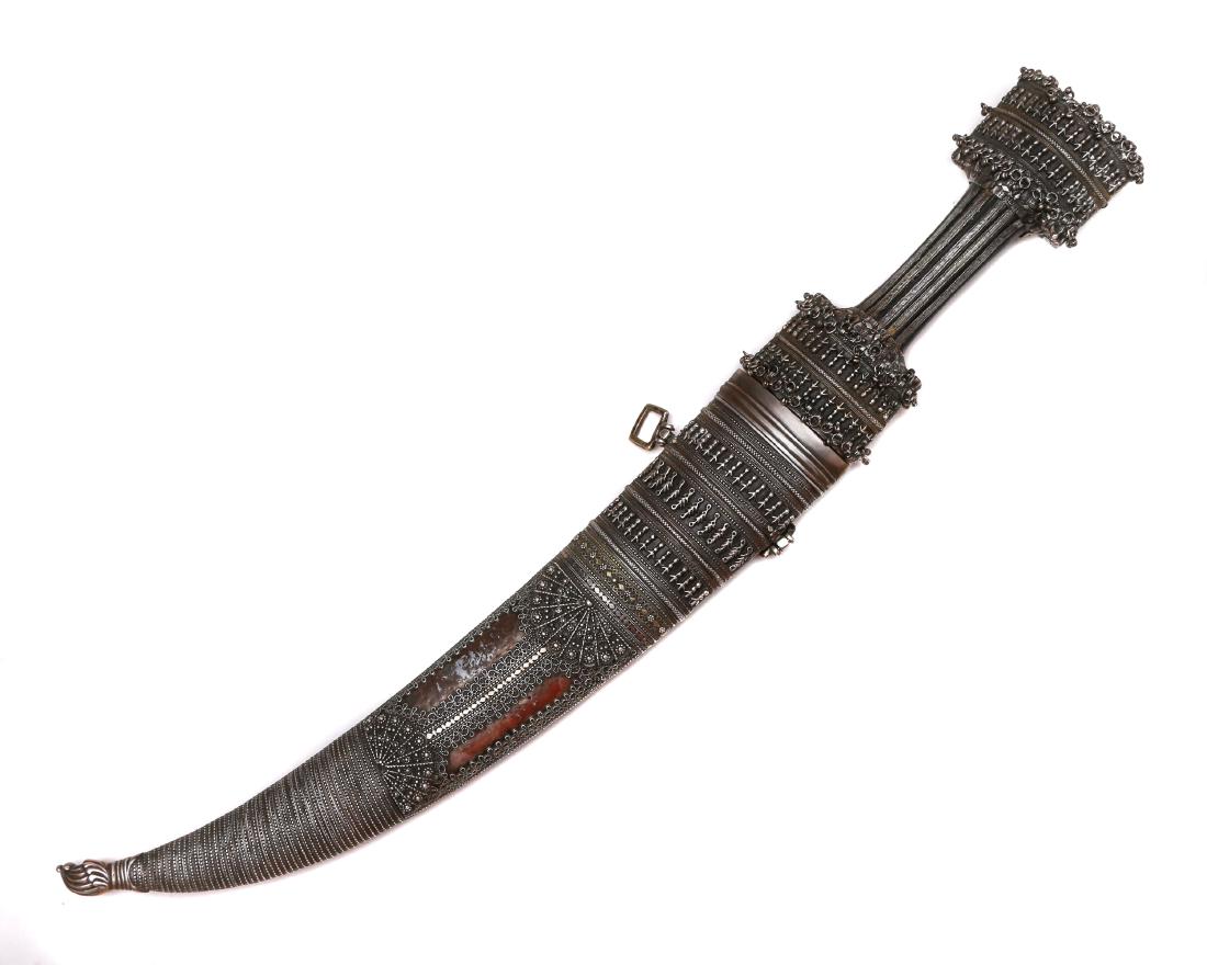 SILVER MOUNTED TURKISH OTTOMAN JAMBIYA DAGGER: Islamic Kurdish, Ottoman or Turkish giant jambiya dagger. Most likely from Eastern Turkey, with strong Kurdish/Iraqi influence, 19th century. Dark wood or horn hilt mounted with silver pommel and grip