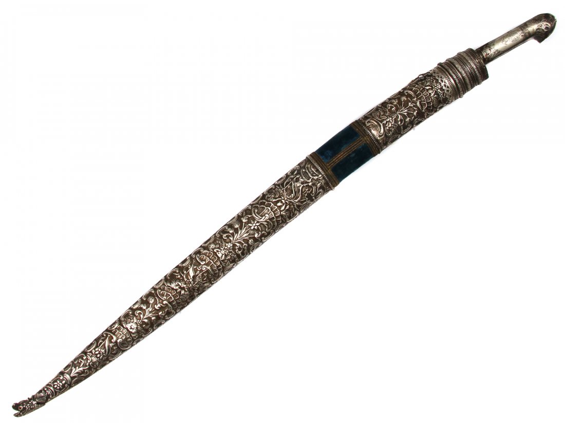 ISLAMIC OTTOMAN SILVER REPOUSSE YATAGAN W. CHAIN: Of characteristic form with nielloed pommel, Turkish "baroque" style repousse silver mounts with chain attached to the sheath. Re-curved blade with maker's mark and Arabic inscriptions. Provenance: Co
