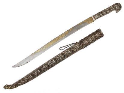 ISLAMIC OTTOMAN EMPIRE YATAGAN WITH GOLD INLAY: An exceptional yatagan with chiseled, engraved, and repousse silver mounts, re-curved blade decorated with gold inlay. Circa 19th century. Dimensions: L: 24 5/8 in., ( 62.5 cm.)