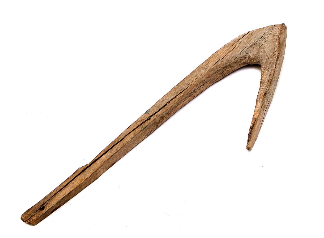 AFRICAN TRIBAL WAR CLUB OR AXE: Made of solid wood with a hook-like head, probably African, 19th C. Dimensions: L: 20 in., (51 cm.)