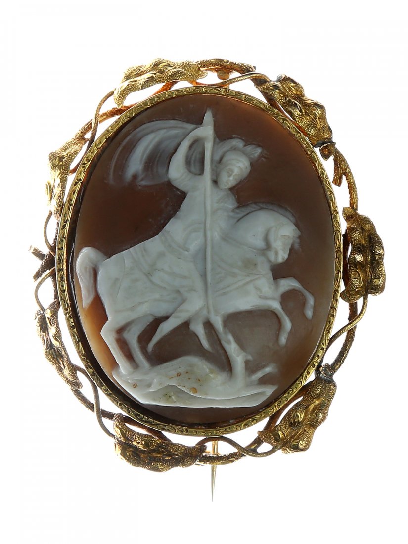 A RUSSIAN SARDONIC CAMEO WITH CARVED ST. GEORGE: A Russian finely carved sardonic cameo featuring St. George. The carved saint is presented in a traditional early way Byzantine icons and fresco. ca. 1880. H: 2 1/8 in., (5.5 cm.)