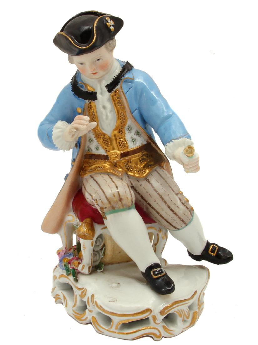 MEISSEN PORCELAIN SEATED BOY FIGURE: A Meissen porcelain figurine deicing a boy officer in frock coat and tricorn hat sporting a sword and pocket watch. Meissen cross sword marks in blue ink to base and impressed B 94 under glaze. Dimens