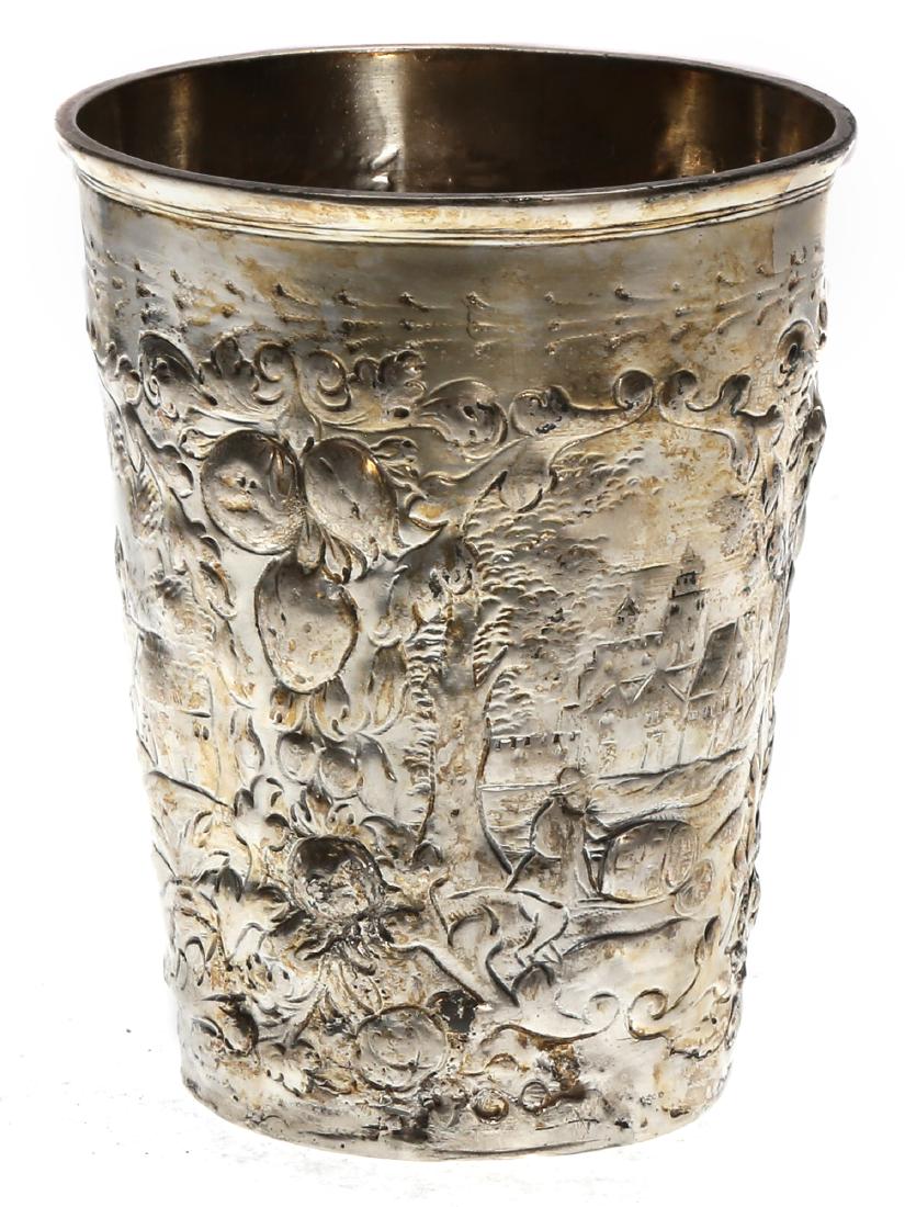 ANTIQUE CONTINENTAL REPOUSSE SILVER BEAKER, 18 C.: 18th century Western European repousse silver gilt beaker depicting a village scene. The owner's monogram is engraved above the peasant figure. Silver hallmarks on the bottom. Weight: 3.25 oz., 102 g.