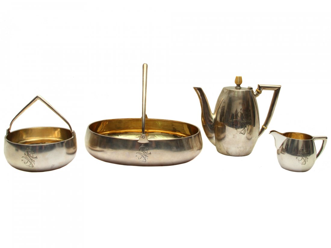 A RUSSIAN ART DECO GRACHEV 4 PCS SILVER GILT SET: Set includes: gilt silver coffe pot, fruit basket with pointy handle, sugar bowl, and creamer. All pieces have gilt interior and engraved with interlocking "DM" in Cyrillic.Hallmarked "Brs. Grachevy",