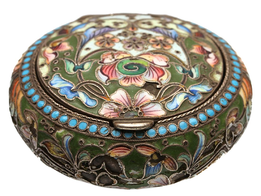 A RUSSIAN CLOISONNE SILVER LIDDED SALT CELLAR: A Russian cloisonne enamel silver hinged lidded salt cellar featuring traditional Russian floral motif. Hallmarks: Russian silver proof 84 and female head. Weight: 2 oz., (58 gr.) Dimensions: D: 2 3/8