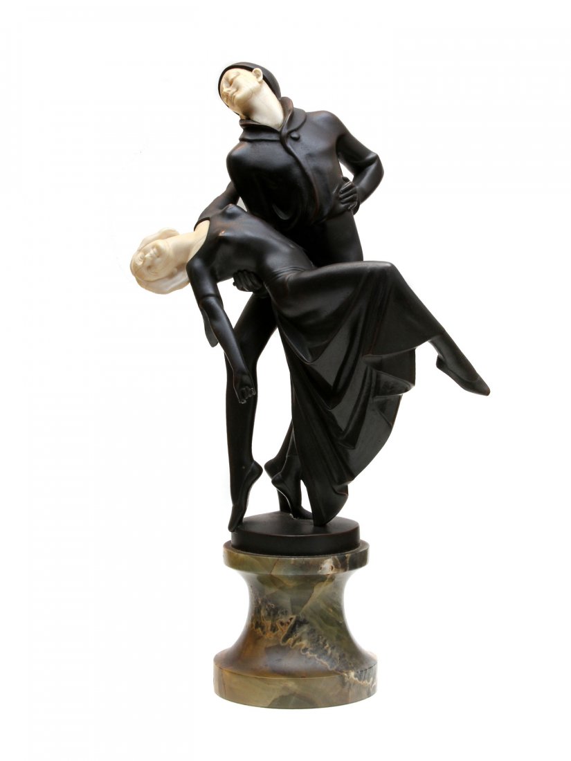 A SIGNED BRONZE BY TERESZCZUK: A DANCING COUPLE: Circa 1918 stamped to bronze base ''P. Tereszczuk'' (Peter Tereszczuk 1875-1963, Austrian) further stamped ''Made in Austria'' depicting a dancing couple on a turned onyx base. Ca. 1920. Dimensions: H