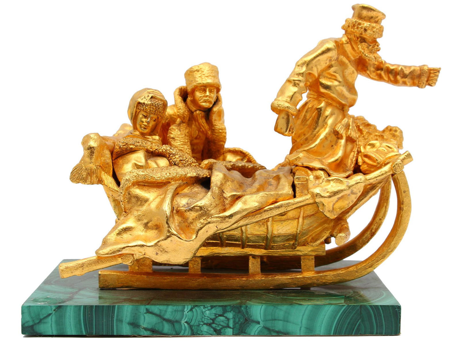 A RUSSIAN GILT BRONZE BY GRACHEV ON SLEDS: A Russian gilt bronze grouping depicting peasants on sleds on malachite base. The work of Grachv, Russia, 19th cen. Dimensions: Base: 7 3.4 x 5 1/2 in., (19.5 x 14 cm.)