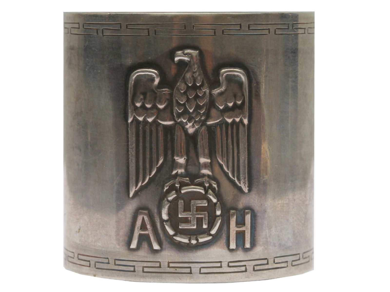 ADOLF HITLER FORMAL PATTERN SILVER NAPKIN RING: Authentic Personal formal table ware napkin ring from Adolf Hitler, bearing a Nazi eagle and swastika device in relief, and by Hitler's initials "A H", top and bottom has engraved "Greek key" design.