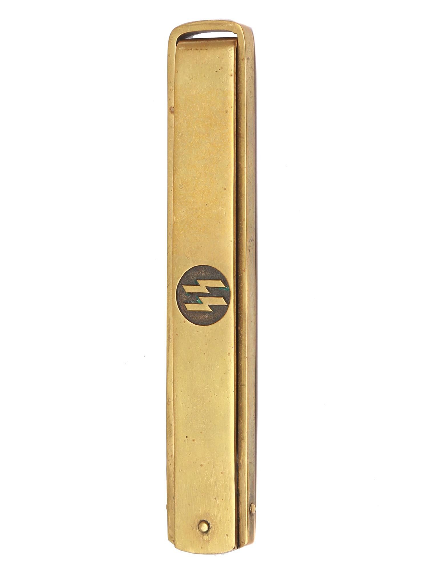 POST WAR GERMAN SS FOLDING KNIFE: Brass handle with etched SS in the circle, straight blade with 1/2 false edge, stamped on the rib "RZM M7/42 SS" Dimensions: L: 9 in., (23 cm.)
