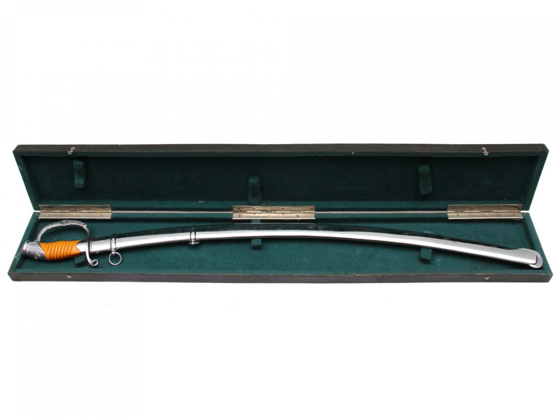 RUSSIAN SOVIET GENERAL SHASHKA SWORD CASED, M1940: Curved, single-edged, chrome-plated blade, with one wide and two narrow fullers on each side, handle with ribbed dark orange plastic grip mounted in chrome-plated pommel and D-guard all engraved with 