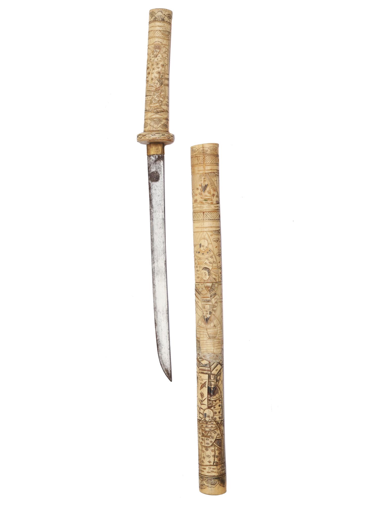 A JAPANESE CARVED TANTO SWORD, 19TH CEN.: Japanese sword in solid carved bone fittings Dimensions: L: 24 in., (61 cm.)