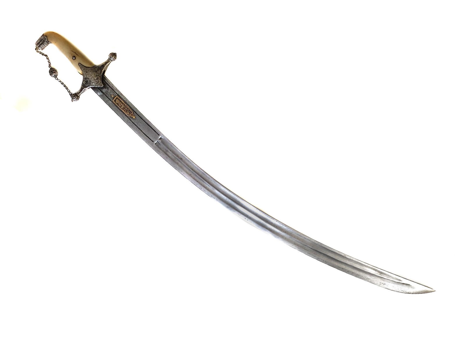 A CAUCASIAN ISLAMIC DAGESTAN GILT-BLADE SWORD, 19TH C.: Ð Dagestan saber with carved bone grip scales, engraved and nielloed silver crossguard and pommel interconnected with a characteristic Kubachi-designed silver chain and filigree work ball. The inscri