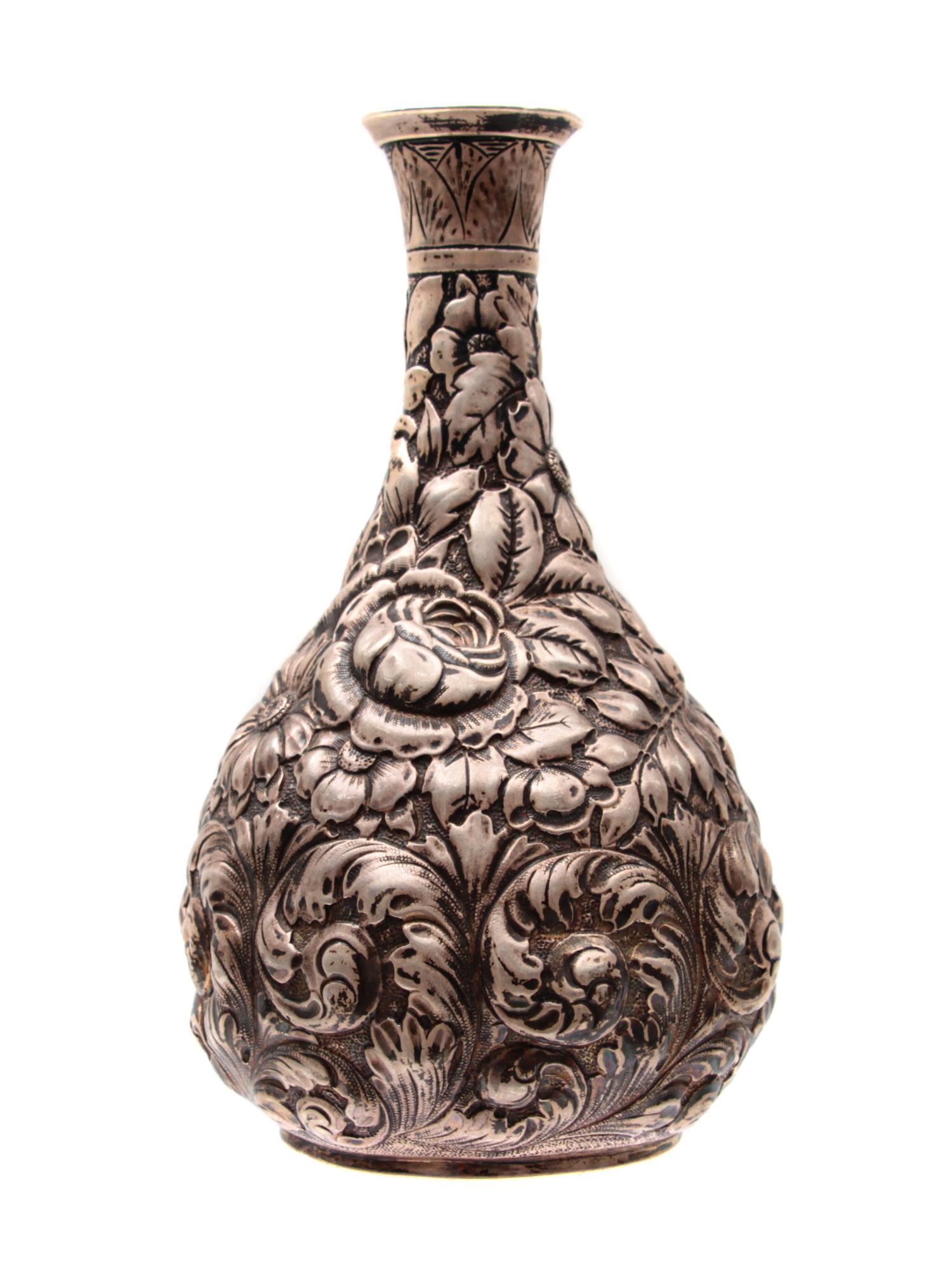 AN AMERICAN SILVER REPOUSSE DECANTER OR JUG, 19TH C. (1 of 3)