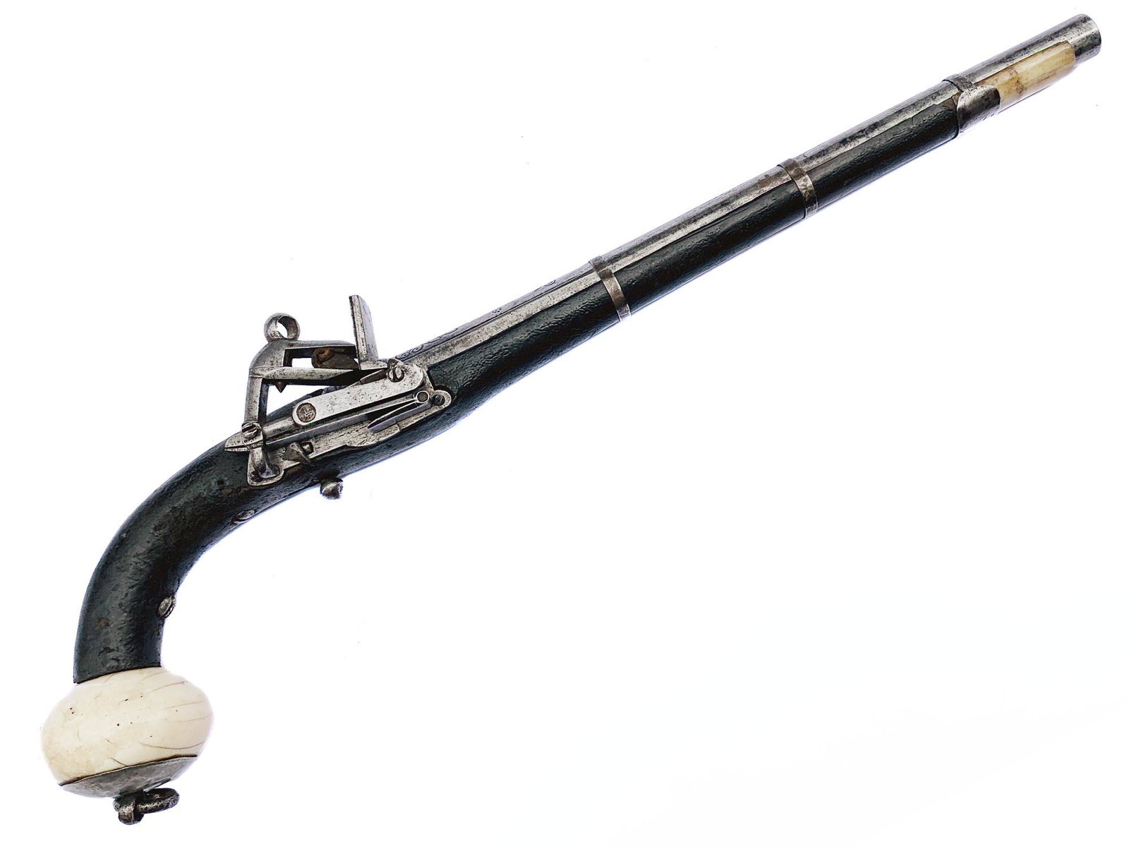 A CAUCASIAN FLINTLOCK PISTOL 19TH CEN.: A Caucasian (Circassian) flintlock pistol with a maker's mark on the lock, with a characteristic carved ball as handle terminal, wooden stock covered in black leather (original), chiseled breech.Good 