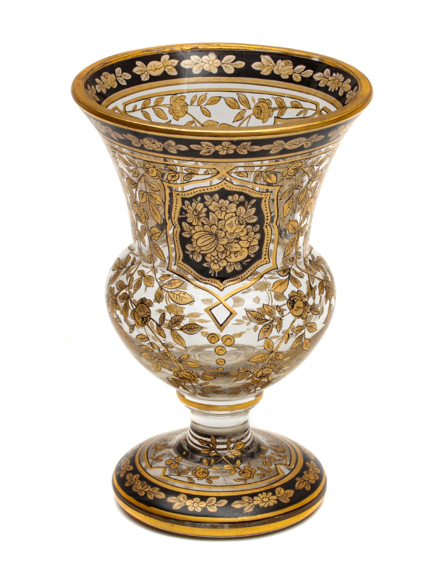 AN ANTIQUE ART GLASS VASE BY MOSER. LATE 19TH C.: A delightful glass vase or large goblet skillfully hand-blown painted and inlaid in Bohemia (Czech Republic). The transparent glass vase is decorated with delicate floral ornaments of gold and black e