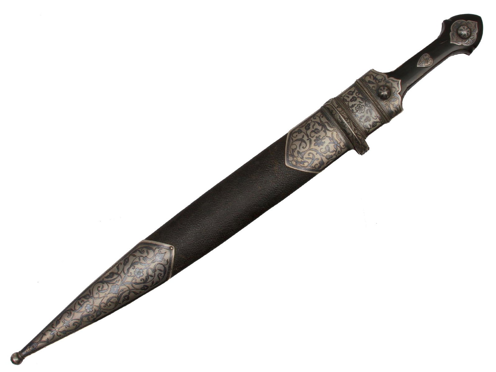 A LARGE CAUCASIAN ISLAMIC SILVER-MOUNTED DAGGER: Horn grip scales with niello silver fittings, wide double-edged blade with three fullers on each side, wooden scabbard covered with original black leather with niello silver mounts.Late 19th century. 