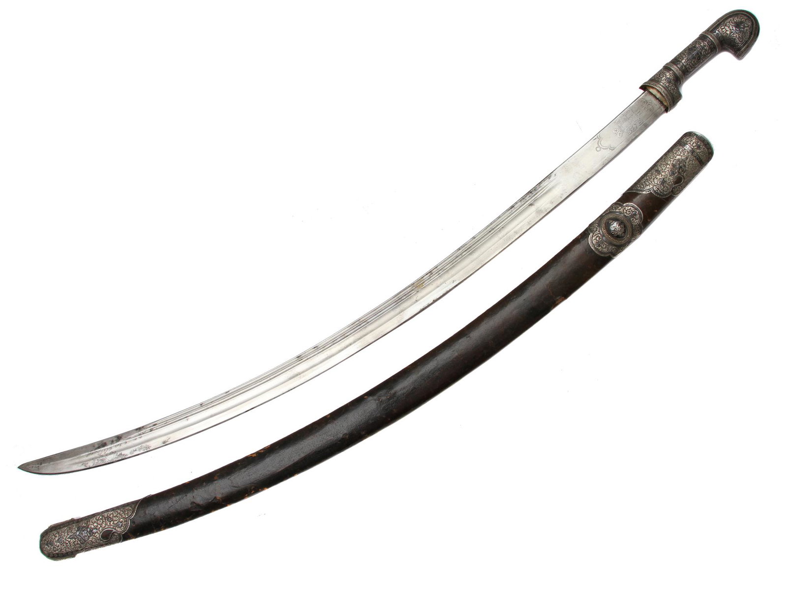A CAUCASIAN GUZUNOV SHASHKA IN SILVER MOUNTS 1916: A Russian shashka mounted in chiseled and niello silver. Curved blade with two fullers, engraved on the forte with the Tsar Nicholas II monogram "HII" surmounted by a crown, stamped with double-headed