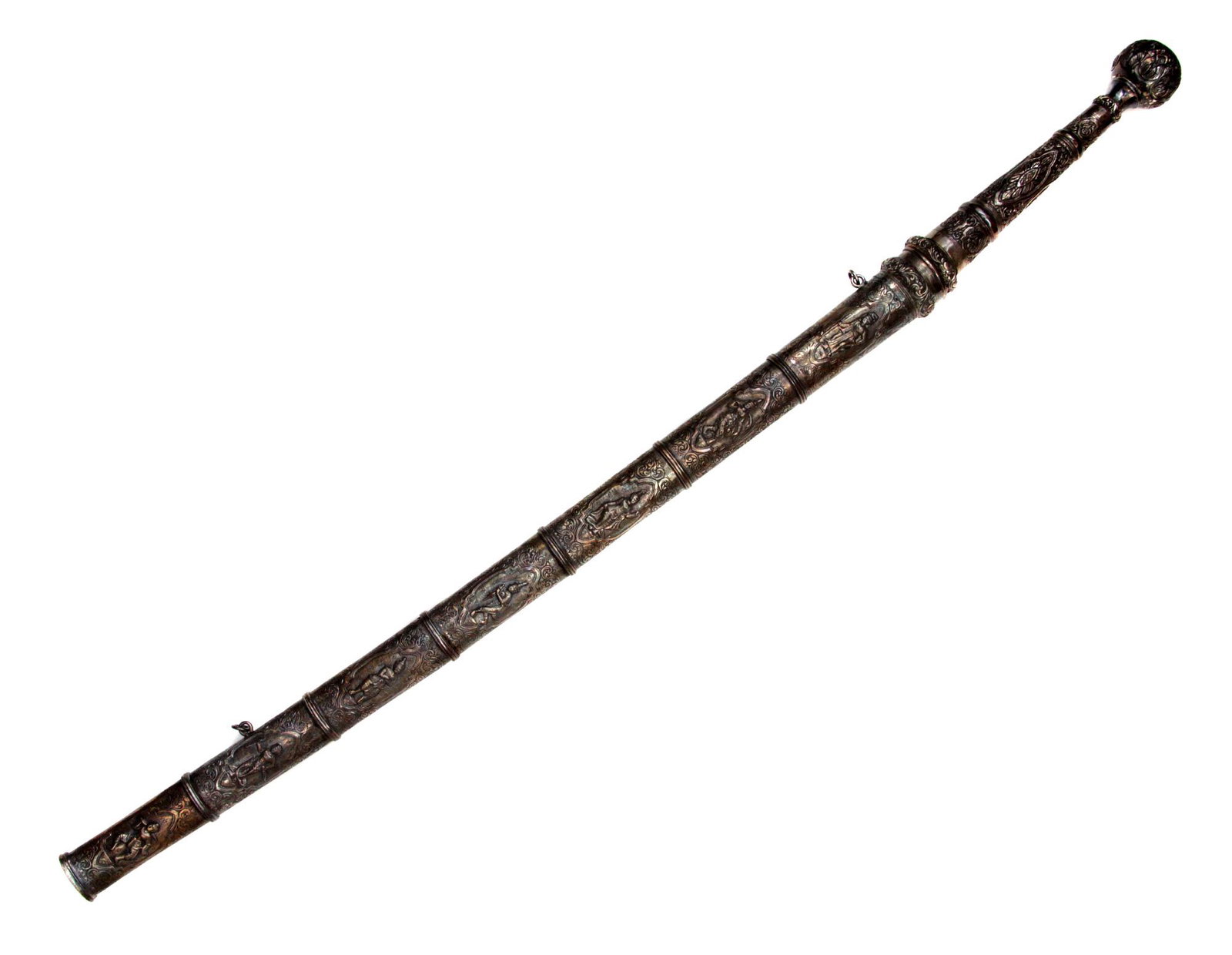 A BURMESE DHA SILVER-MOUNTED SWORD, 19TH C.: A large silver-mounted Dha sword with double-handed grip. The hilt and scabbard are decorated with hand-hammered and engraved figures and floral motif, the pommel is a of spherical form chiseled with 