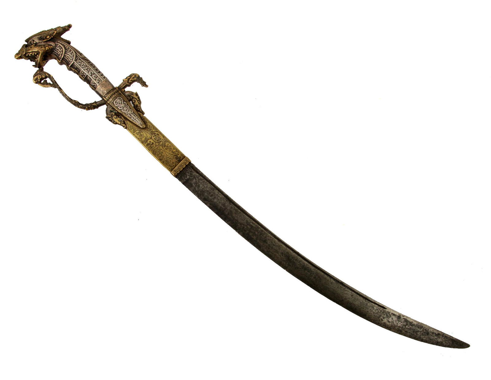 A SINHALESE KASTANE SWORD, SRI LANKA, 18 CENTURY: Kastane is a short traditional ceremonial/decorative single-edged Sri Lankan sword. The hilt is made of chiseled silver as a stylized monster "Makara" with the head forming the pommel, intricately chi