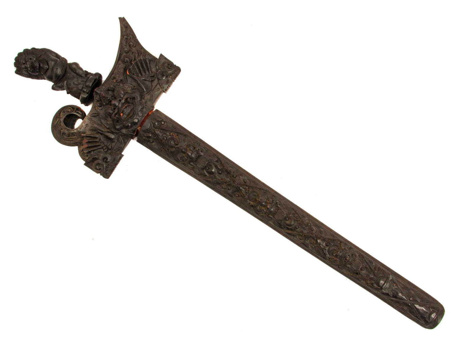 AN INDONESIAN MALASYAN KRIS DAGGER: Typical blade and exceptionally fine wayang Hulu (hilt) with intricately carved dark hardwood, and same scabbard , brass ferrule with stones. Dimensions: L: 27 in., (69 cm)