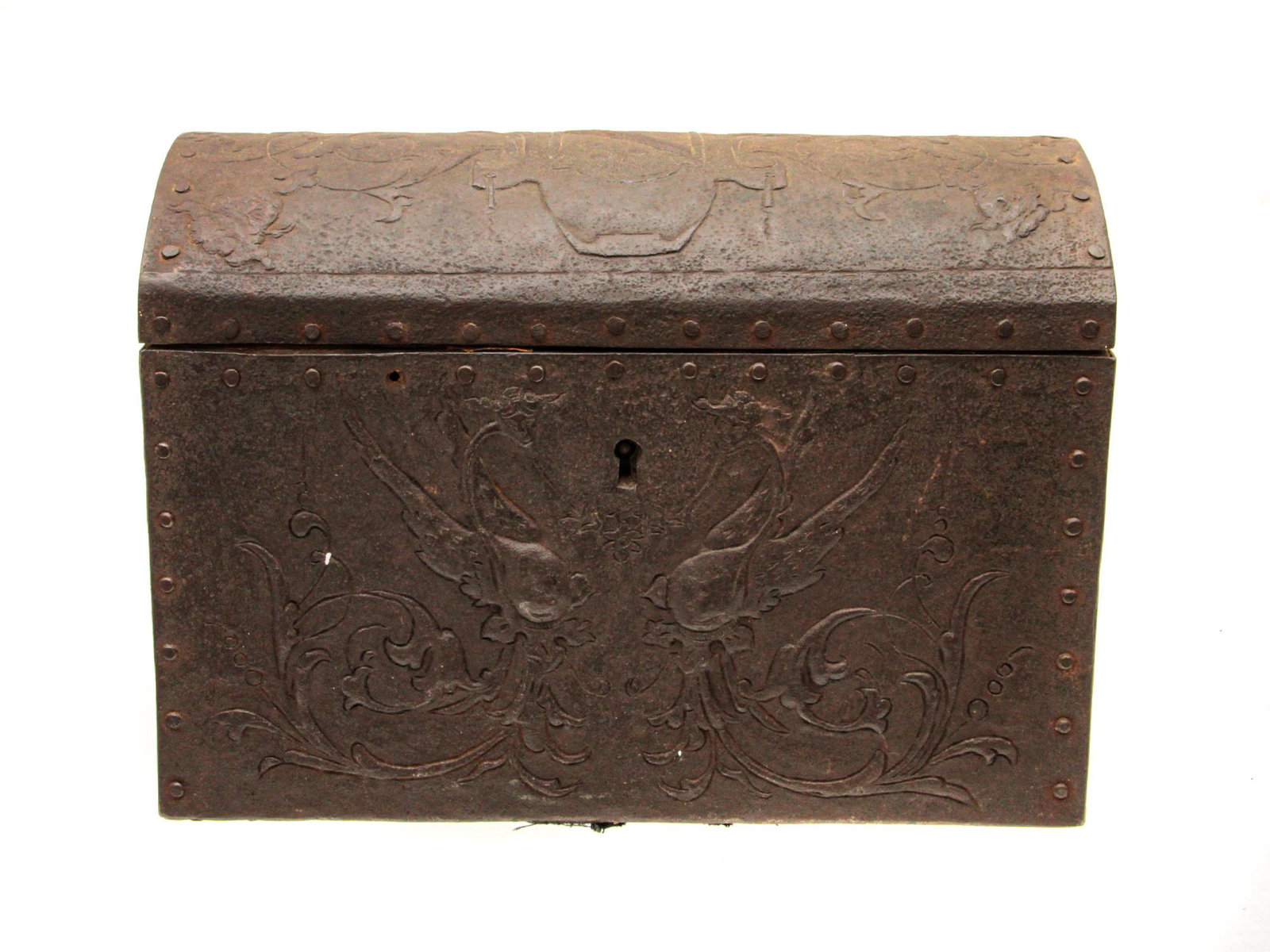 AN ANTIQUE FRENCH IRON CASKET CIRCA 1550-1620: An French iron box in the shape of a chest with an embossed Renaissance grotesque pattern. The interior is covered with red fabric lining with a white floral pattern. Dimensions: 8 3/4 x 4 1/2 x 6 1/3