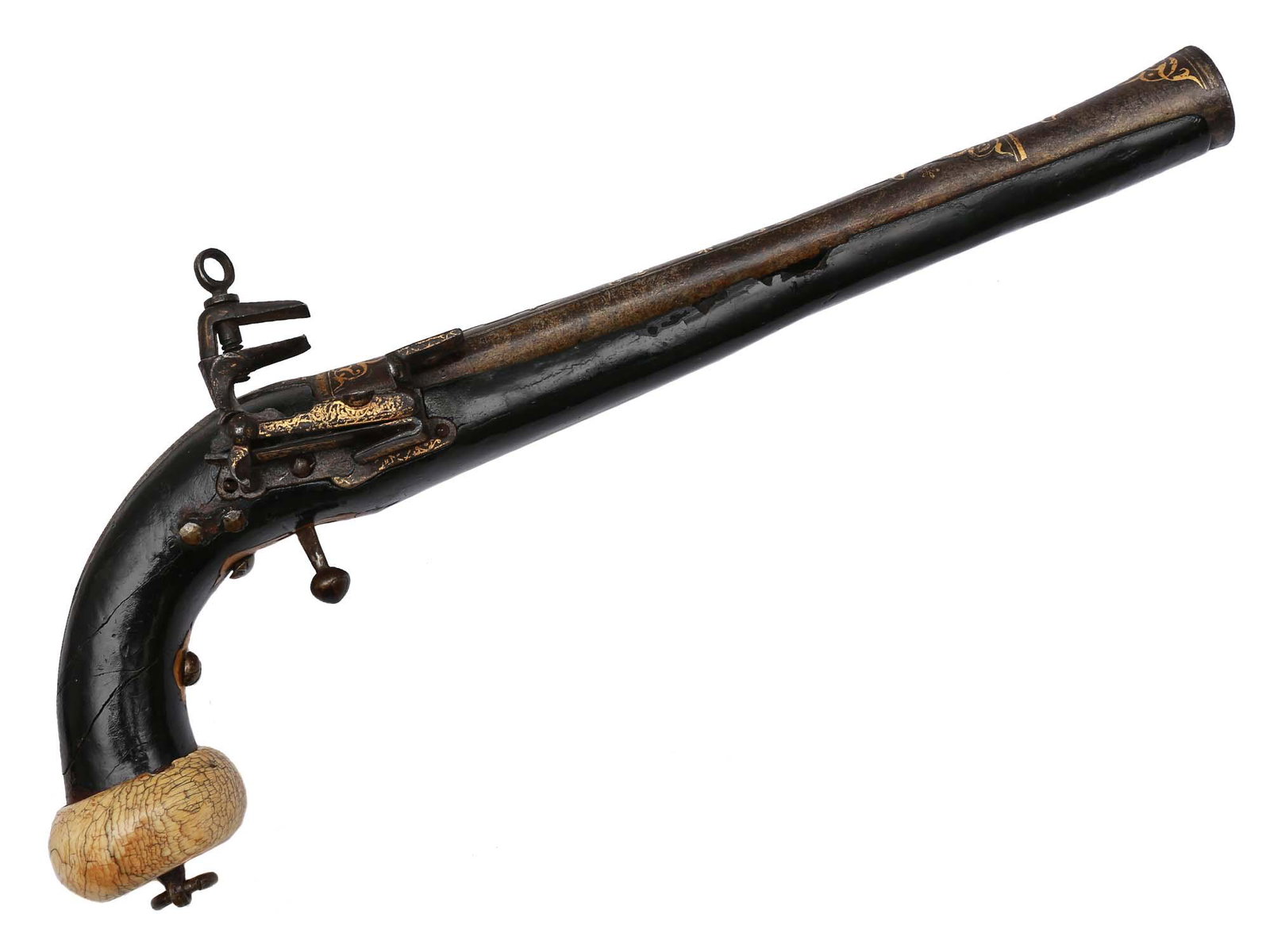 A CAUCASIAN FLINTLOCK PISTOL W GOLD INLAY, 19 C.: A Caucasian flintlock pistol caliber, cal. 15 mm, with wooden stock covered in black leather, gold inlay decorated lock, chiseled barrel, and handle steel rib. A characteristic carved flattened ball a