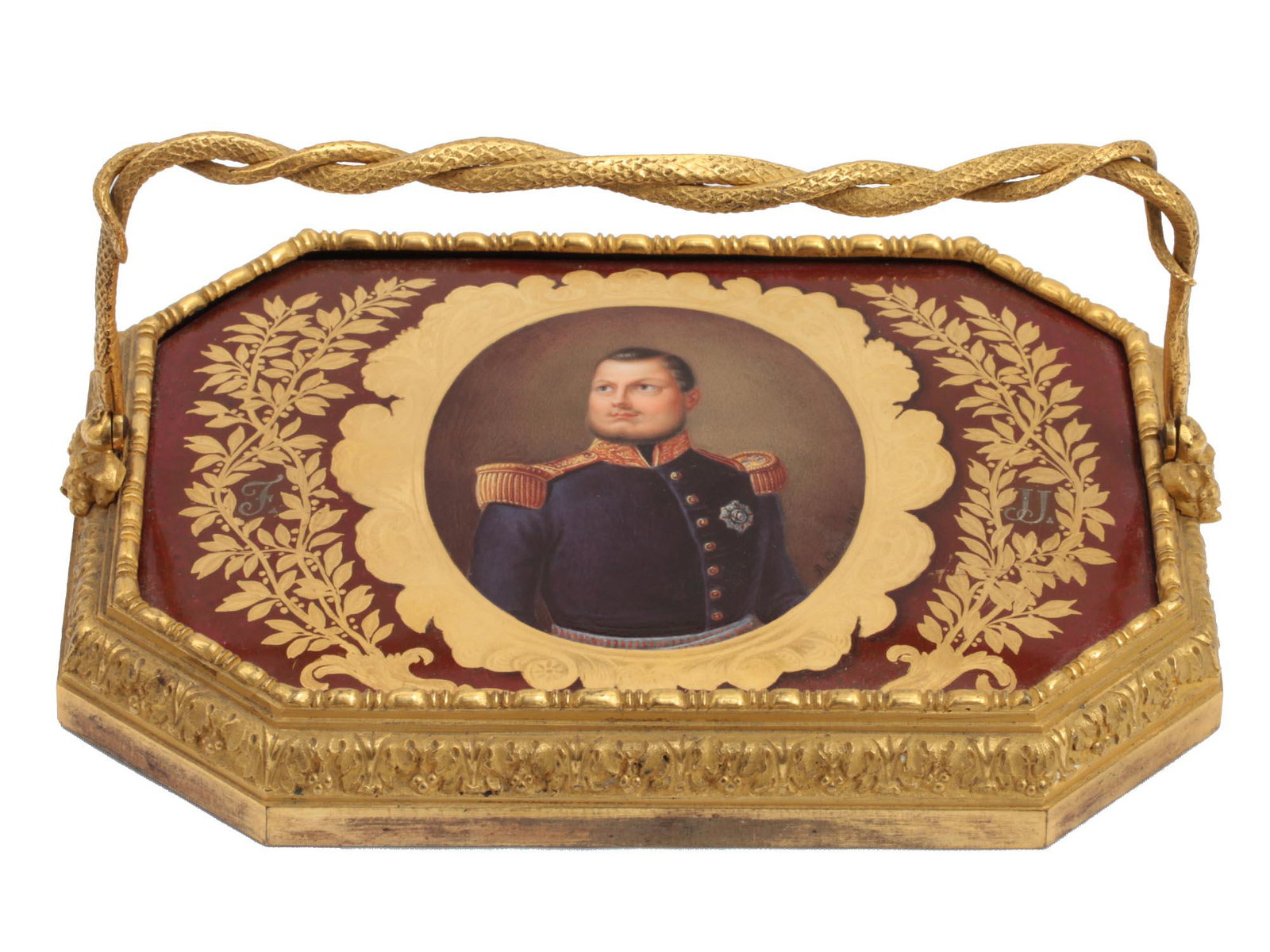A BELGIAN PAPERWEIGHT WITH PORCELAIN PANEL 19TH C: A paperweight in gilded bronze with a hand-painted porcelain plaque depicting a Belgian officer. The portrait is signed and dated (lower right). The miniature is surrounded with a gilt flower wreath w
