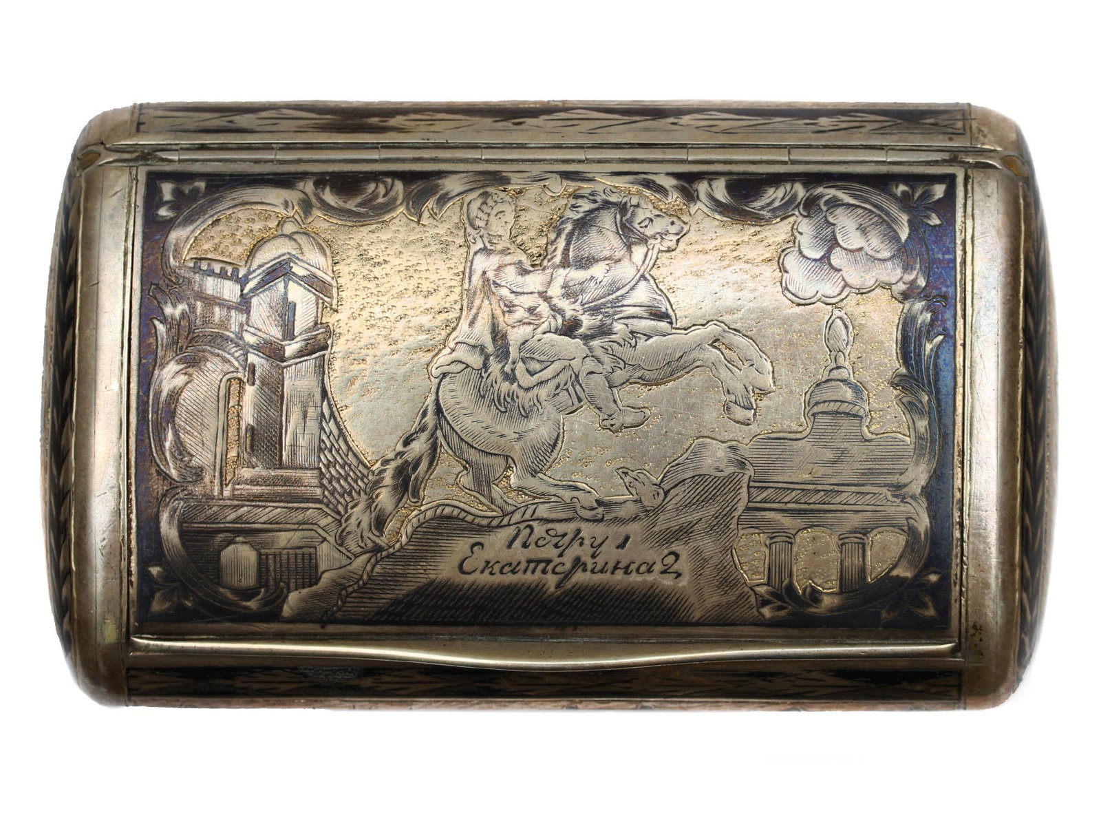 A RUSSIAN GILT-SILVER PETER THE GREAT BOX, 1827: An early Russian gilt-silver and niello snuff box depicting mounted Peter the Great with Russian inscription below the rider: to Peter I/Catherine.Silver hallmarks: AS, 84, NA, 1827.Weight: 4.1 o., 11
