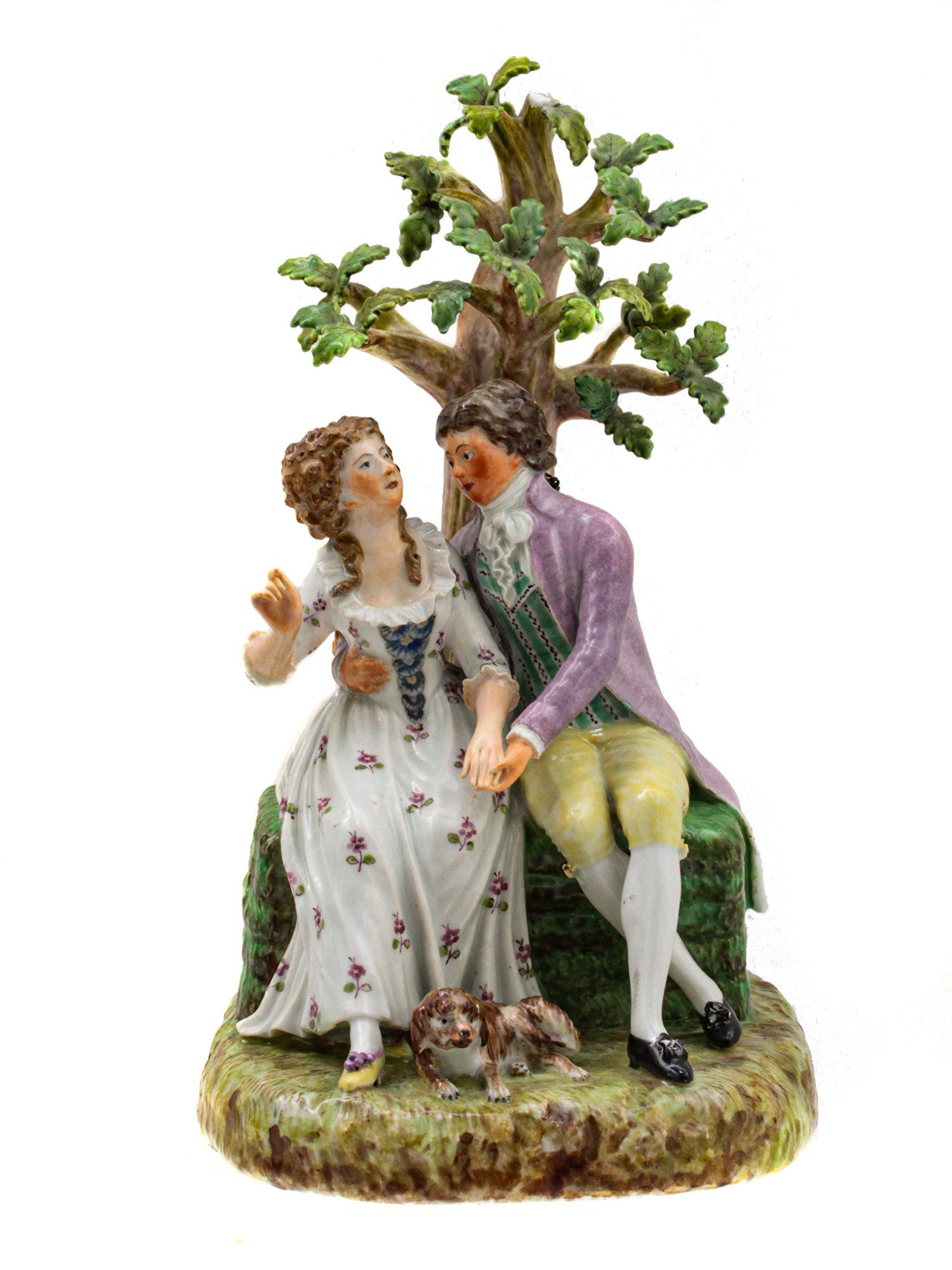 A RUSSIAN IMPERIAL PORCELAIN FACTORY, CA. 1860: The grouping depicts a flirting couple seating by a tree.Marked on the verso with three dots in dark blue ink. Dimensions: H: 9 1/2 in. (24.1 cm.)