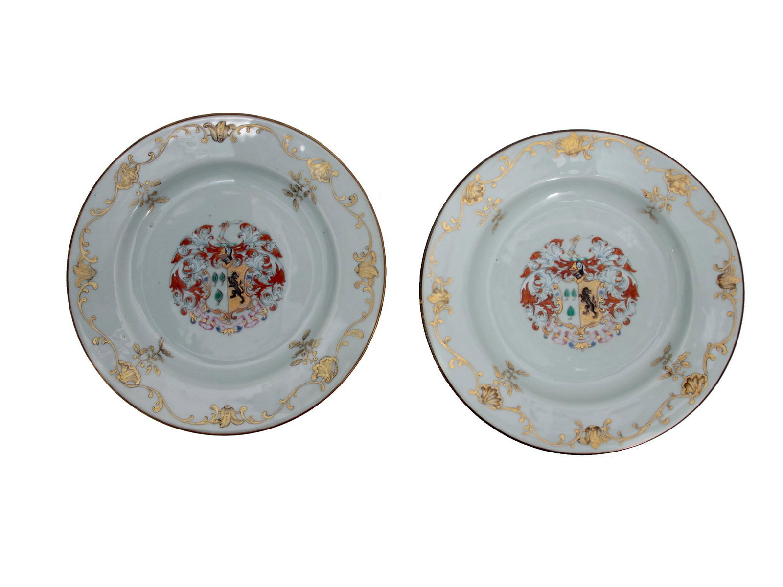 A FINE PAIR OF CHINESE EXPORT ARMORAL PLATES: Chinese pair of porcelain export large plates that are boldly painted with arms of Foulis Impacing Jones that is illustrated by " Chinese Armorial Porcelain" by David Howard. The plates are decorated 