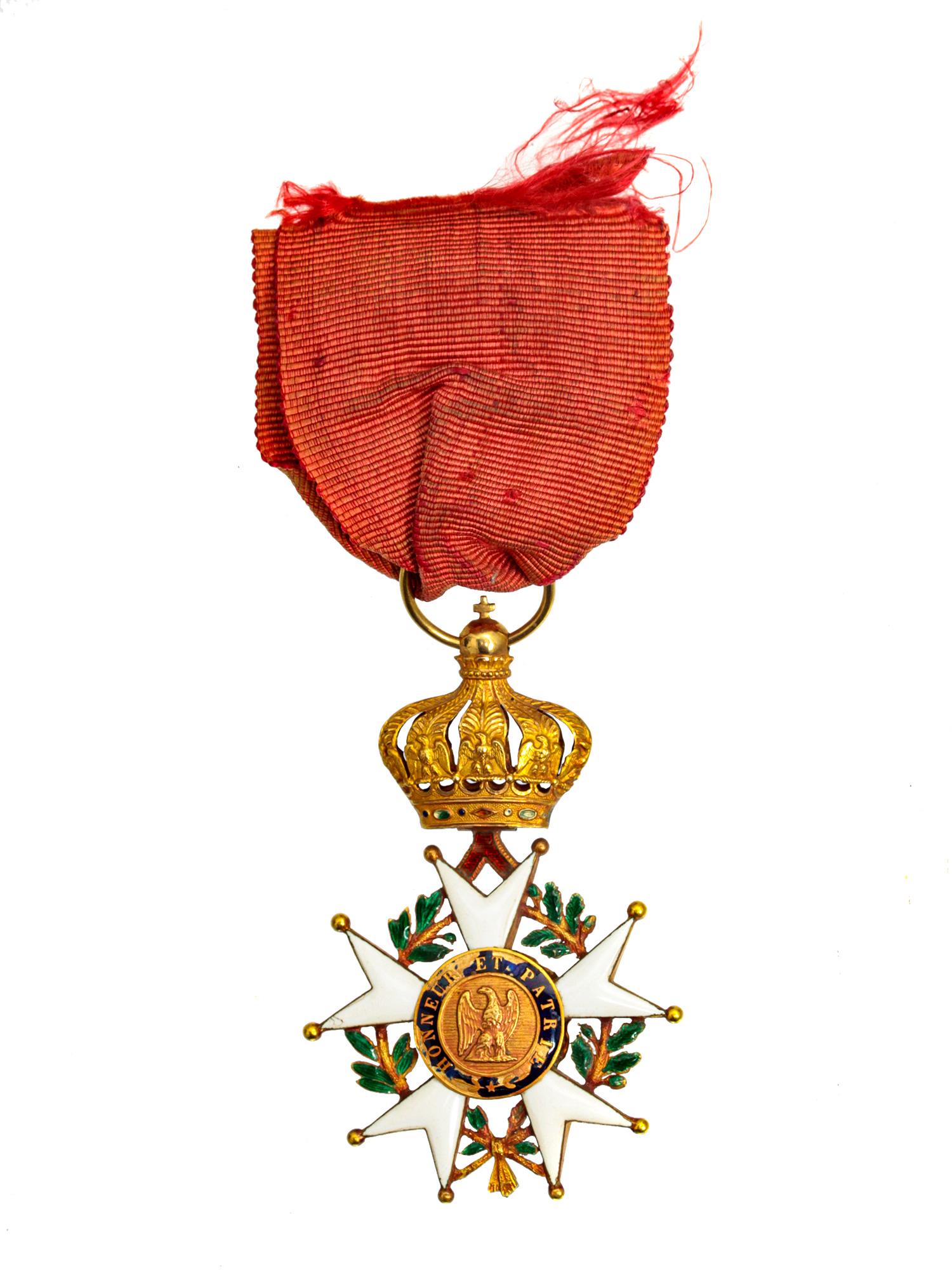A GOLD FRENCH ORDER OF THE LEGION OF HONER: The LÃ©gion d'Honneur order is a five-pointed star with doubled rays. The star is surrounded by an oak and laurel wreath. On the obverse, there is an Emperor's portrait with lettering: "NAPOLÃ‰ON