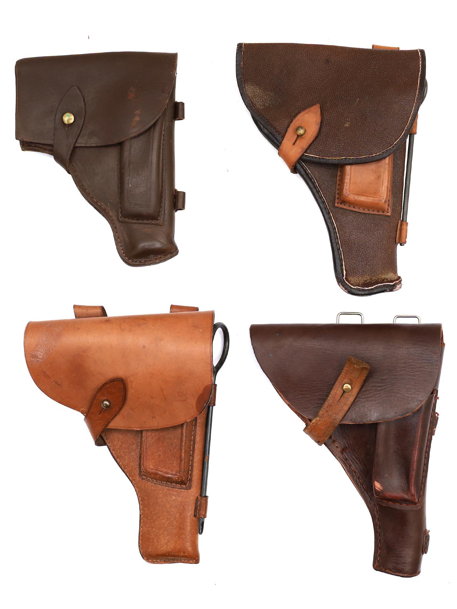 FOUR SOVIET RUSSIAN PISTOL HOLSTERS, MAKAROV, TT: A set of different variations of original Soviet pistol holsters used for Makarov 9 mm pistol, Tokarev TT pistol. Two holsters bear original factory stamps and date.