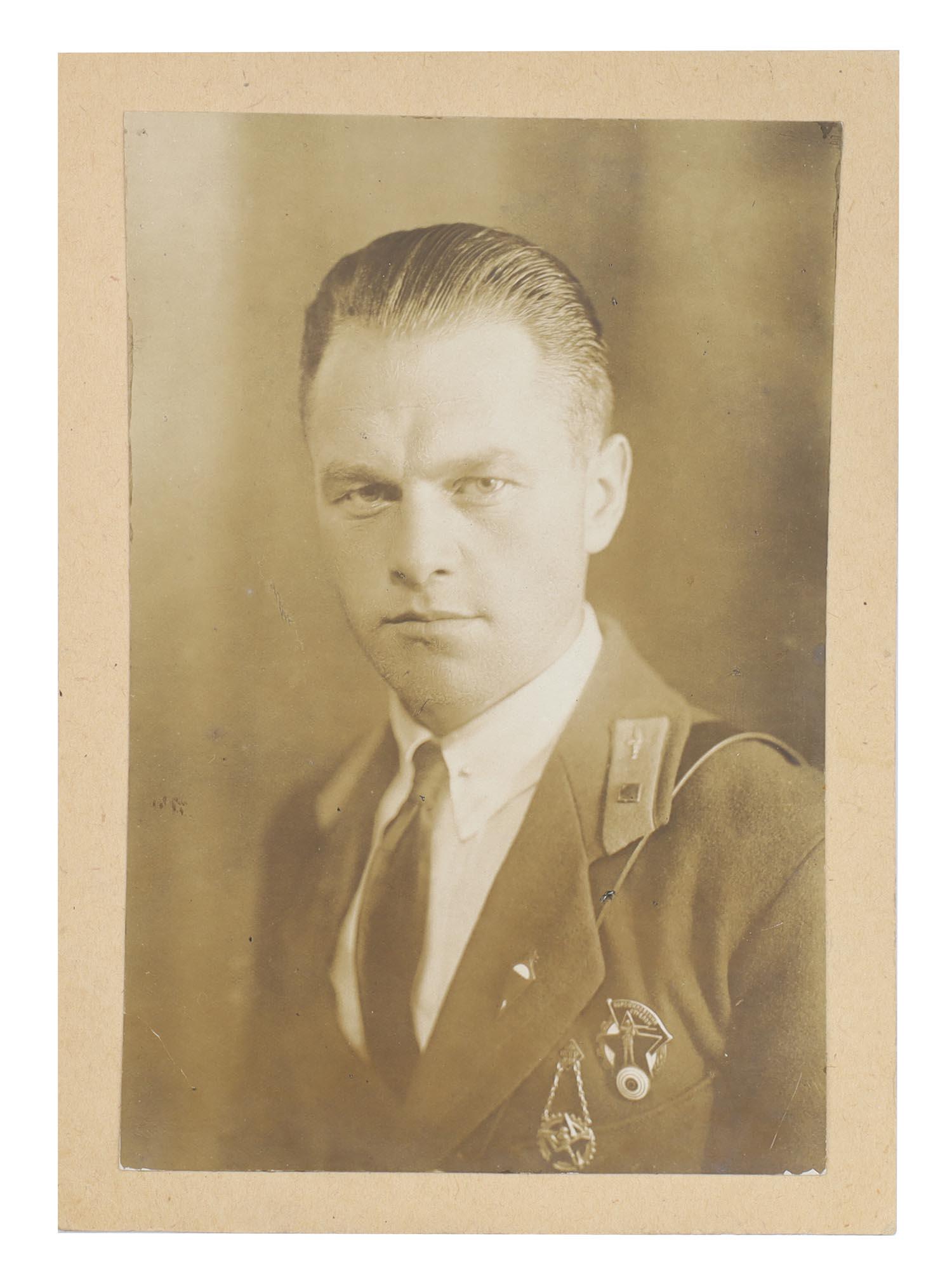 A EARLY SOVIET RUSSIAN PHOTOGRAPH, RARE BADGES (1 of 2)