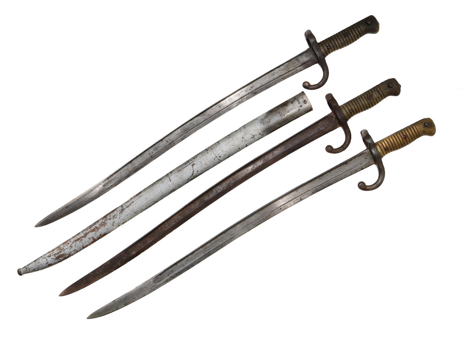 A LOT OF THREE FRENCH M1866 YATAGAN BAYONETS: Three Yatagan-style sword bayonets for the 11 mm. M1866 Chassepot needle-fire rifle. Bayonets bear factory marking and inspection marks. Dimensions: L: 28 in., ( 71.1 cm.)