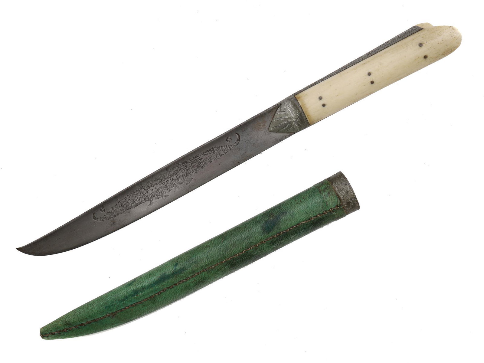 A CRETE DAGGER WITH SILVER INLAY IN SHEATH, 19 C.: With a straight single-edged blade engraved on both sides with a foliage motif, with a characteristic eared form hilt made of carved bone scales and metal mounts engraved with a wavy motif. Scabbard c