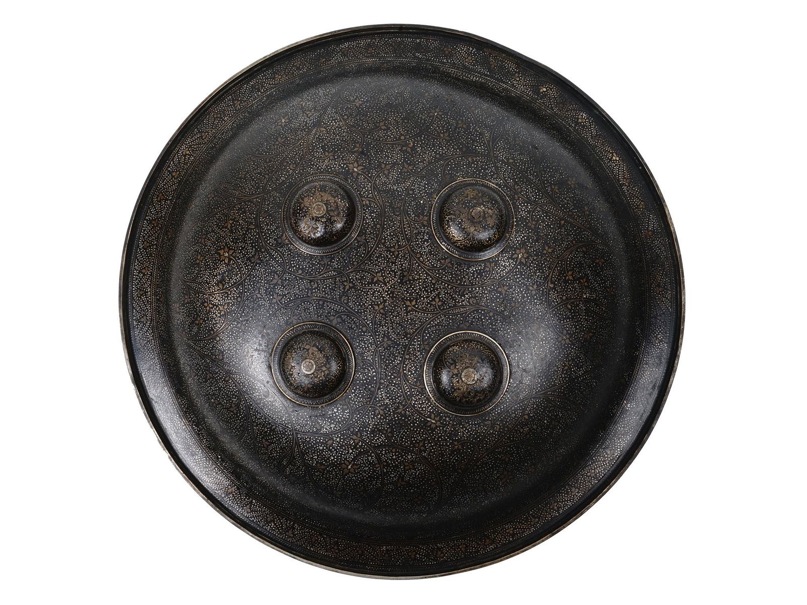 AN ANTIQUE INDIAN IRON DHAL SHIELD WITH GOLD INLAYS: An antique Indian shield, or a dhal, made of shallow convex iron, fitted with four domed bosses corresponding to enarmes on the inside. Decorated with gold inlays in the koftgari style with foliage mo