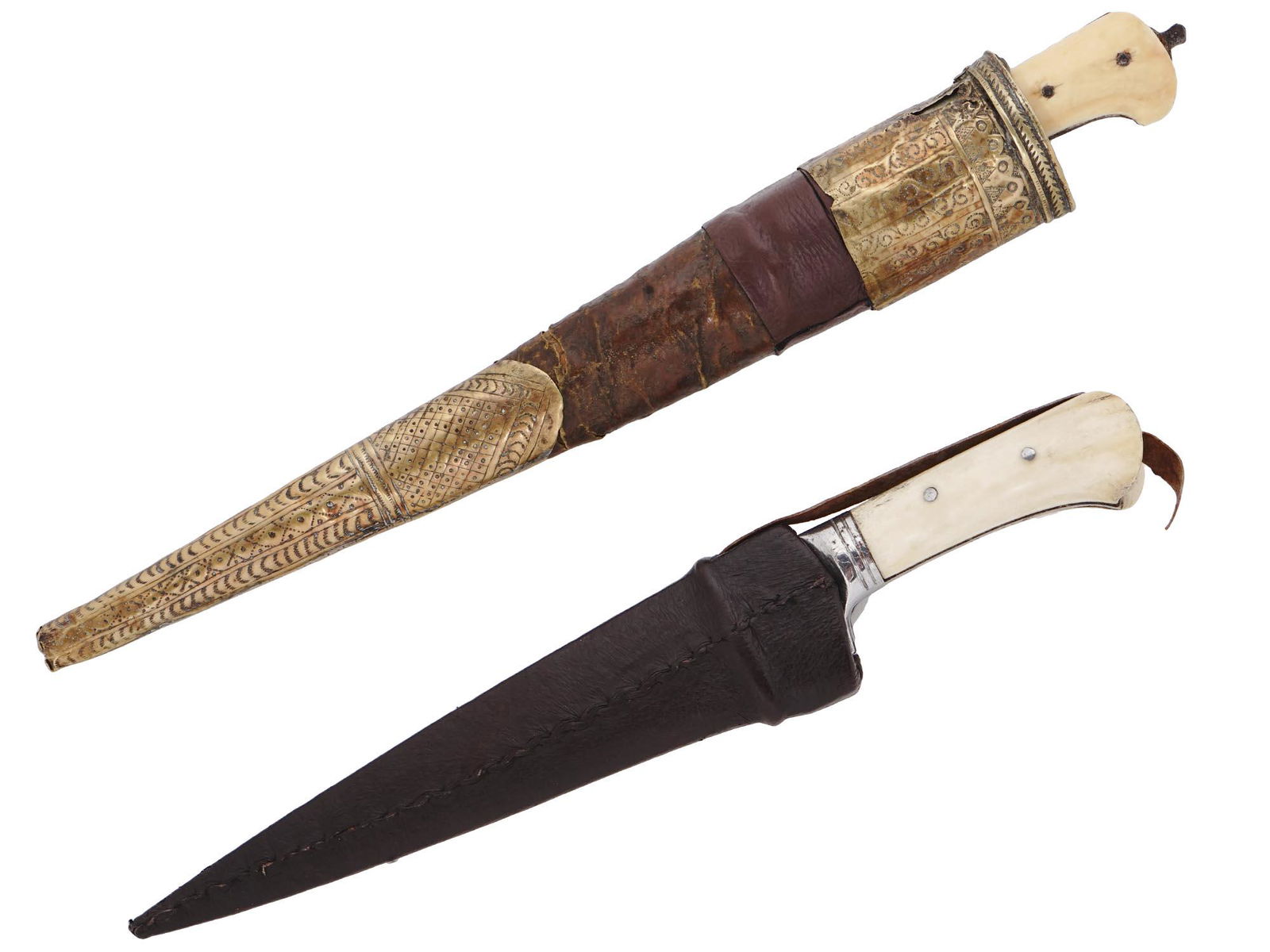 A PAIR OF ISLAMIC KARD DAGGERS: A pair of kards daggers both with carved bone grip scales secured by metal rivets, and wood scabbards one covered with stitched leather and another mounted with chiseled brass fittings. Dimensions: L: