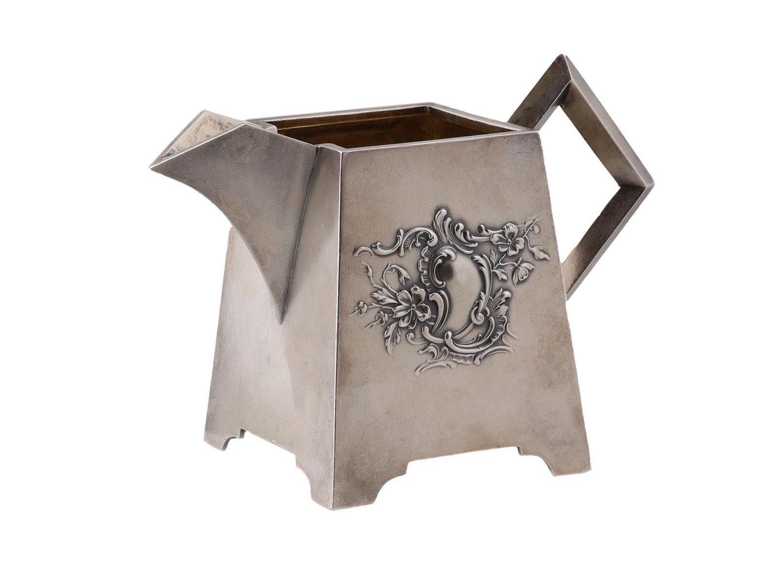 A RUSSIAN SILVER ART DECO CREAMER BY KLINGERT, C. 1910: Antique Russian Art Deco sterling silver creamer by Gustav Klingert, St. Petersburg, circa 1910. Features a gilded interior and an embossed decoration with floral motifs on the front side. Hallmarks: 