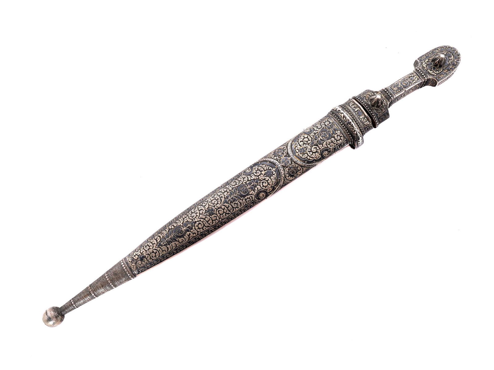 A CAUCASIAN SILVER-MUONTED DAGGER WITH NIELLO: Of a characteristic form with a double-edged pointy blade with one fuller on each side. The scabbard and grip are made of silver decorated with a traditional engraved floral motif and applied niello.