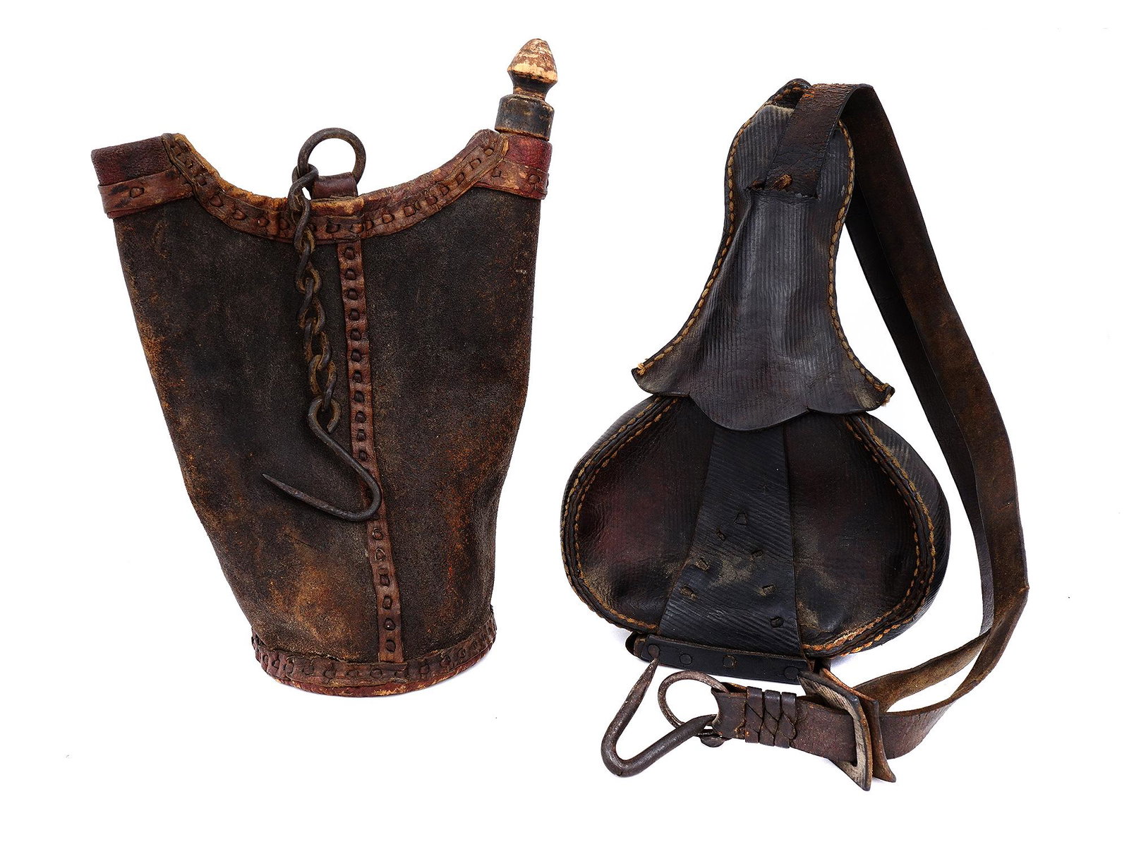 TWO EASTERN EUROPEAN LEATHER WATER FLASKS, 19TH CEN.: Two Eastern European leather water flasks, one is the form of a bag with leather trimming, a plug-lock and a metal ring to which a hook is attached on a chain, while the other features a bottle shape 