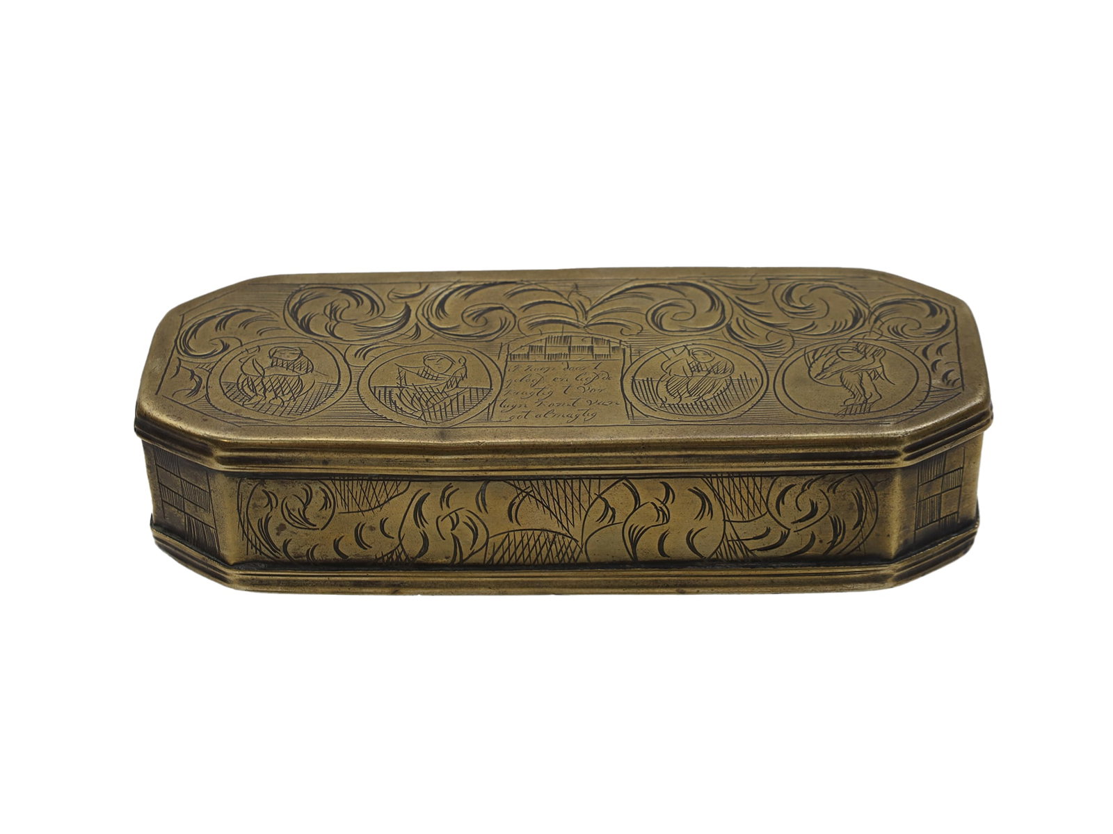 A BRASS ENGRAVED DUTCH TOBACCO AND SNUFF BOX, 18TH CEN.: Hand-made heavily decorated elongated tobacco box with rounded corners displays an unusual interior scene featuring a coat of arms with two lions. The box has a cigarette holder on the inside of the l