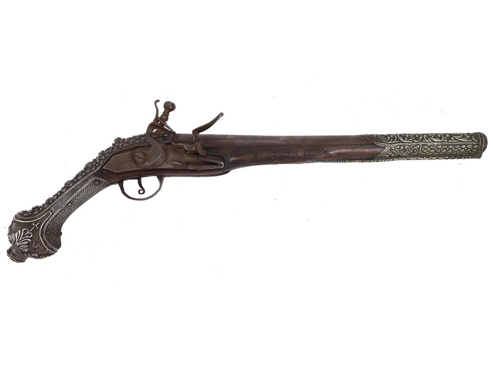 AN OTTOMAN BALKAN GREEK FLINTLOCK PISTOL, LATE 18TH C.: A long flintlock pistol with chiseled silver fittings and wire inlay. Ottoman Empire, circa 1800. This ornate pistol was probably made in the Balkans in the late 18th century. It has an angular barrel