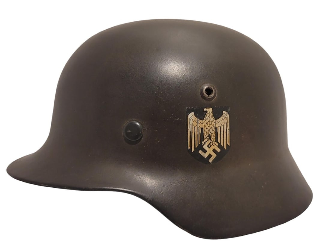A WW2 NAZI GERMANY DOUBLE DECAL HELMET: Heer M35 Double Decal Helmet. The shell is stamped C682. Original liner stamped size: 55. Liner stamped Size 55.