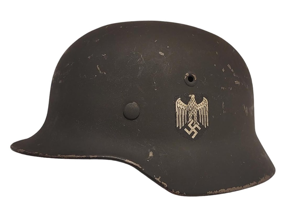 A WW2 NAZI GERMANY ORIGINAL HEER M40 HELMET: Heer M40, original decal, untouched split pins, original liner marked size 57. The shell is stamped 6413. Paint thinning on top. No chin strap. Size: 57.