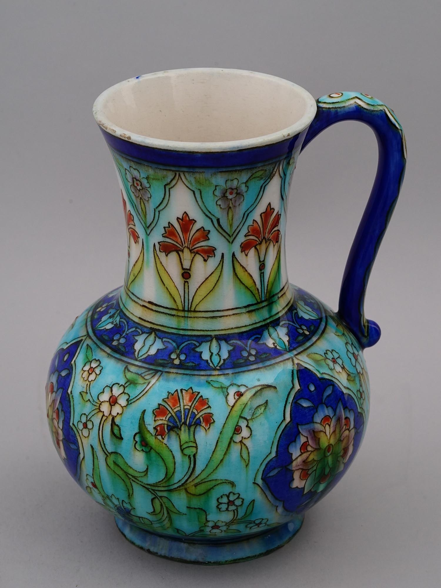 AN ISLAMIC DESIGN POTTERY JUG BY THEODORE DECK, 19TH CEN.: A lovely 19th-century French art nouveau pottery jug by Theodore Deck, painted with organic scrolling foliage, modeled in the 16th-century Ottoman style. Joseph-ThÃ©odore Deck (2 January 1823 â€�