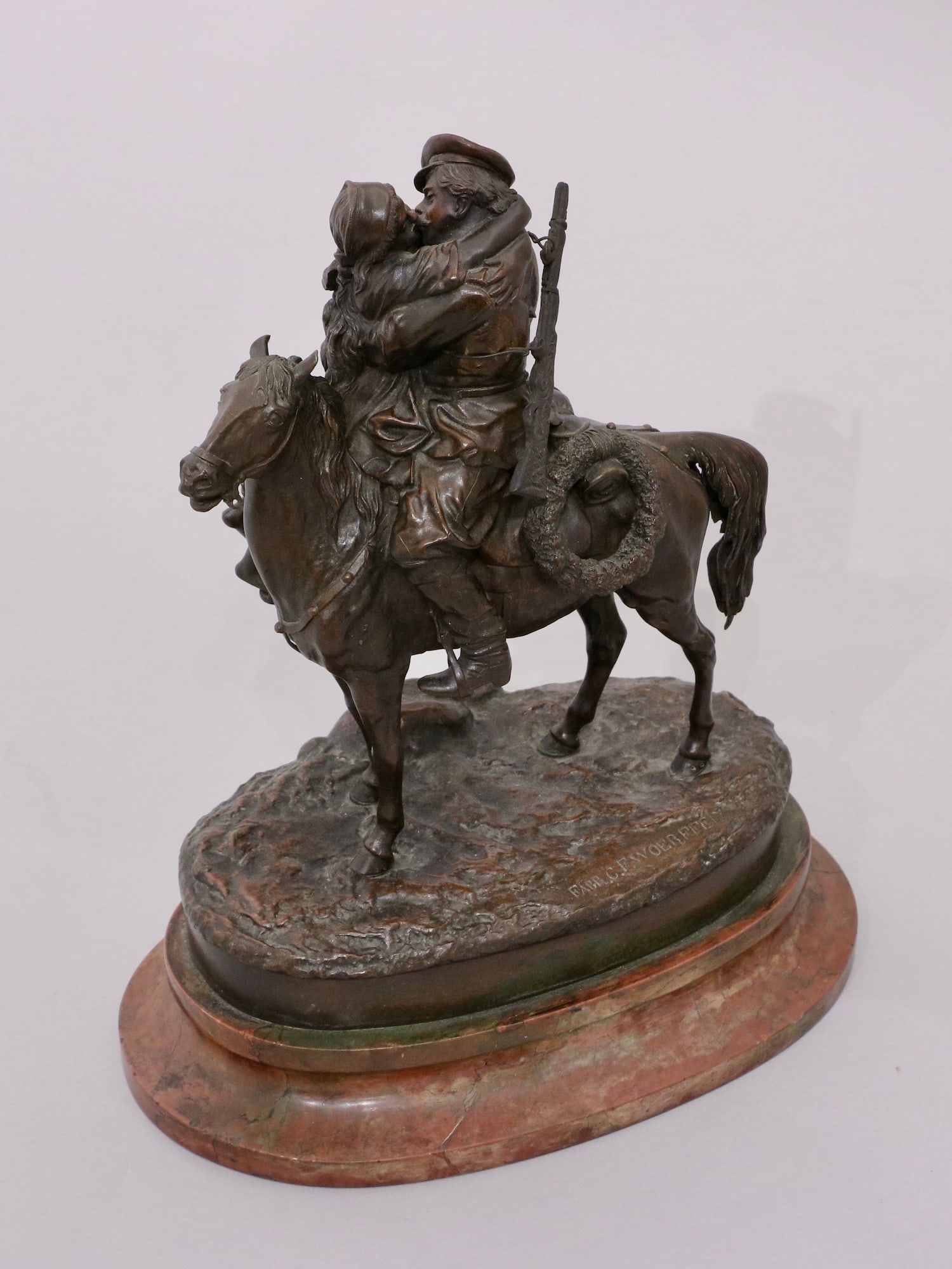 A RUSSIAN BRONZE GROUPING BY GRACHEV FAREWELL KISS, 19TH C.: A Vasily Yakovlevich Grachev (Russian, 1831 - 1905). Cast by C. F. Woerfell. Russian patinated bronze group "Farewell Kiss" mounted on an oval rouge marble base. Excellent detail and quality. Signed i