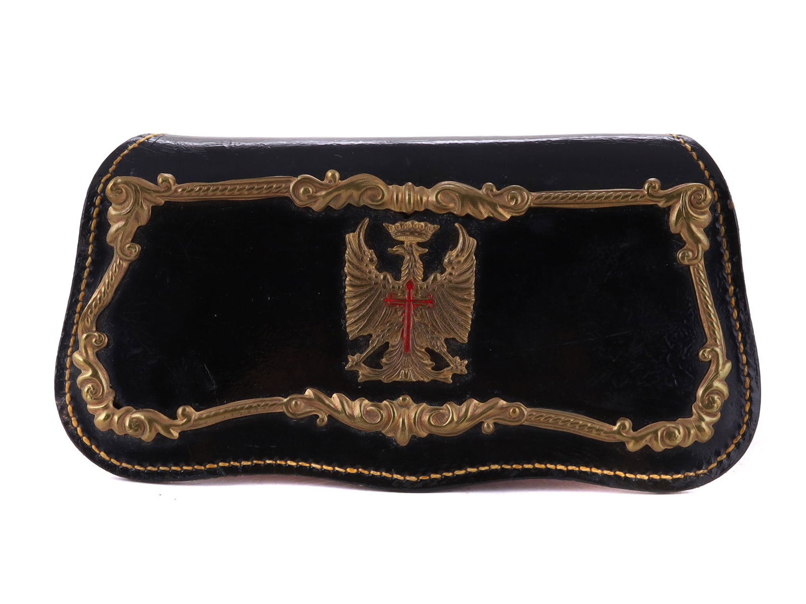 AN SPANISH MOROCCAN LEATHER BRASS MOUNTED POUCH: A red and black leather pouch with reinforced metal sides, decorated with hammered brass trim and a coat of arms eagle. Spain, the reight of Franco, WW2 L: 6 1/2 in., (16.5 cm.)