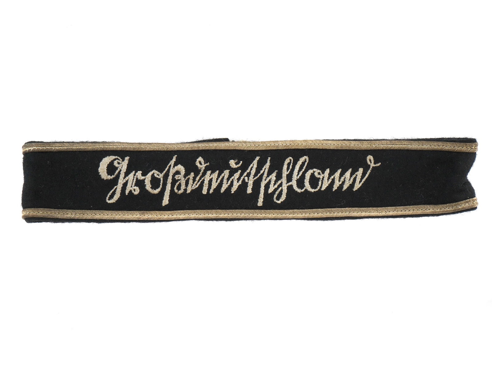A RARE NAZI GERMAN 3RD PATTERN 'GRO?DEUTCHLAND' CUFF TITLE: Rare 3rd pattern 'Großdeutschland' (Greater Germany) cuff title of the Panzer Grenadier Division in good condition. L: 16 1/2 in., (41.91 cm)