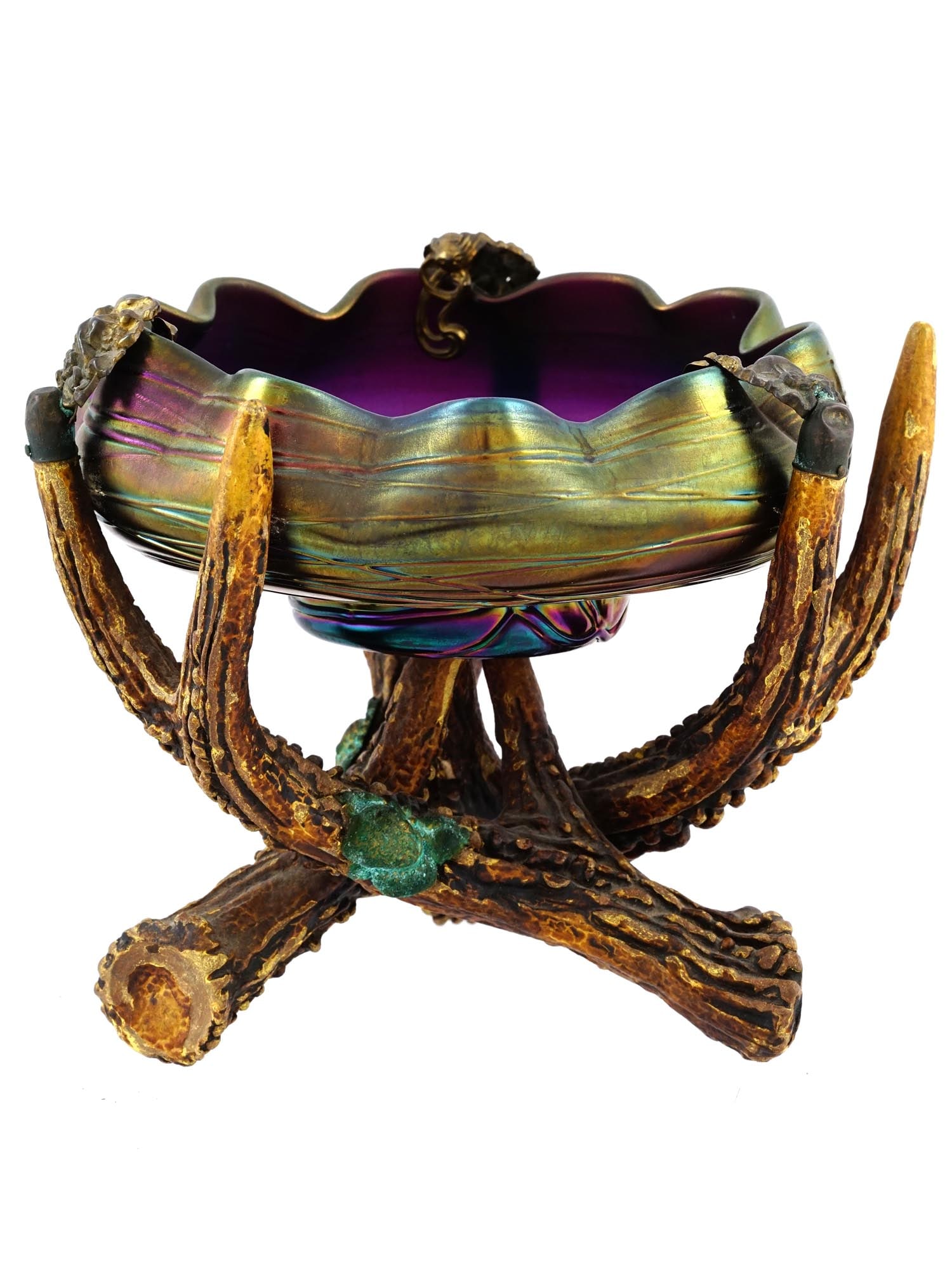AN ANTLER HORN MOUNTS LOET GLASS BOWL: Bowl of an iridescent Loetz style art glass with a threaded amethyst mounted on stag horn base, Marvin & Kay Kraus, NE. Provenance: The Collection of William Cervera (5/31/51 - 3/15/22), New York. H:
